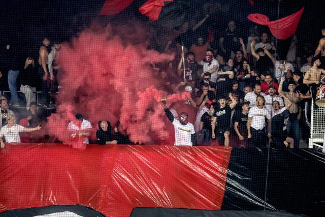 Nice's supporters light flares during the French L1 football match between OGC Nice and RC Lens at the Allianz Riviera Stadium in Nice on May 2, 2026. (Photo by Valery HACHE / AFP)