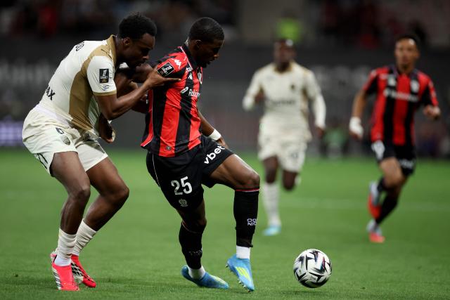 Lens' Austrian defender #06 Samson Baidoo (L) fights for the ball with Nice's French forward #25 Mohamed-Ali Cho during the French L1 football match between OGC Nice and RC Lens at the Allianz Riviera Stadium in Nice on May 2, 2026. (Photo by Valery HACHE / AFP)