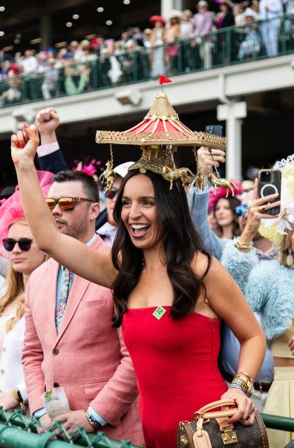 A woman cheers during the 152nd running of the Kentucky Derby at Churchill Downs in Louisville, Kentucky, on May 2, 2026. (Photo by Leandro Lozada / AFP)