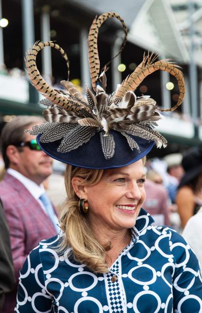 A woman attends the 152nd running of the Kentucky Derby at Churchill Downs in Louisville, Kentucky, on May 2, 2026. (Photo by Leandro Lozada / AFP)