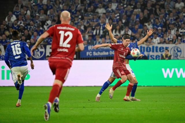 Fortuna Duesseldorf's Swiss forward #13 Cedric Itten and Schalke's Turkish defender #04 Hasan Kurucay (R) vie for the ball during the German second division Bundesliga football match between FC Schalke 04 and Fortuna Duesseldorf at the Veltins Arena in Gelsenkirchen, western Germany on May 2, 2026. Schalke are pushing to return to the first division next season with a win against Fortuna Duesseldorf on May 2, 2026. (Photo by INA FASSBENDER / AFP) / DFL REGULATIONS PROHIBIT ANY USE OF PHOTOGRAPHS AS IMAGE SEQUENCES AND/OR QUASI-VIDEO