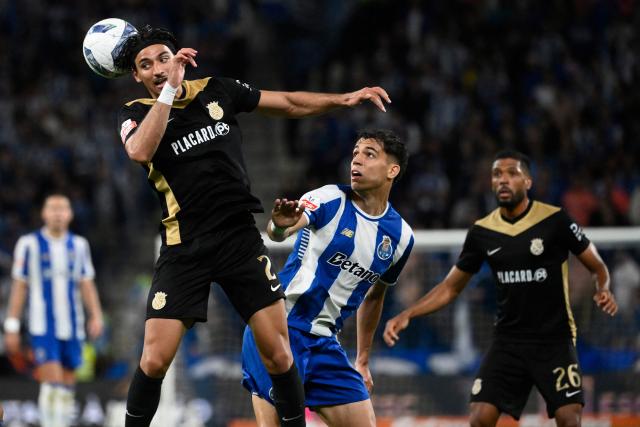 FC Alverca's Moroccan forward # 02 Nabil Touaizi heads the ball next to FC Porto's Spanish midfielder #10 Gabriel Veiga during the Portuguese League football match between FC Porto and FC Alverca at Dragao stadium in Porto, on May 2, 2026. (Photo by Miguel RIOPA / AFP)