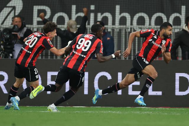 Nice's Tunisian defender #02 Ali Abdi (R) celebrates after scoring a goal during the French L1 football match between OGC Nice and RC Lens at the Allianz Riviera Stadium in Nice on May 2, 2026. (Photo by Valery HACHE / AFP)