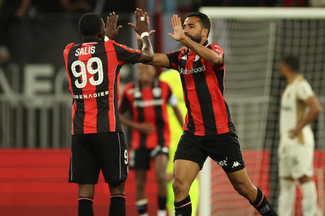 Nice's Tunisian defender #02 Ali Abdi (R) celebrates after scoring a goal during the French L1 football match between OGC Nice and RC Lens at the Allianz Riviera Stadium in Nice on May 2, 2026. (Photo by Valery HACHE / AFP)