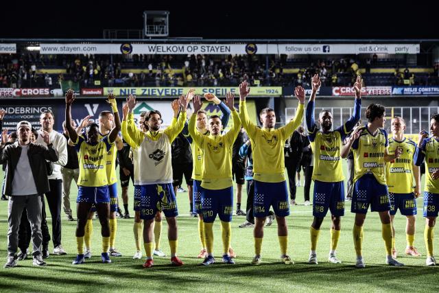 STVV's players celebrate after winning the Belgian Pro League football match between Sint-Truiden VV and Royale Union Saint-Gilloise in Sint-Truiden on May 2, 2026. (Photo by BRUNO FAHY / Belga / AFP) / Belgium OUT