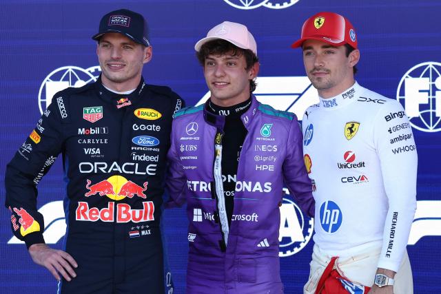 Mercedes' Italian driver Kimi Antonelli (C), winner of the pole position, stands with Red Bull Racing's Dutch driver Max Verstappen (L), who finished second, and Ferrari's Monegasque driver Charles Leclerc (R), who finished third, after the qualifying session for the 2026 Miami Formula One Grand Prix at Miami International Autodrome in Miami Gardens, Florida, on May 2, 2026. (Photo by CHARLY TRIBALLEAU / AFP)
