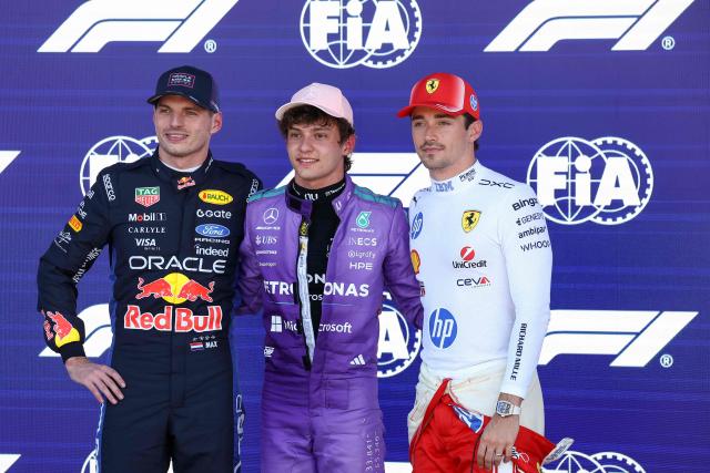 Mercedes' Italian driver Kimi Antonelli (C), winner of the pole position, stands with Red Bull Racing's Dutch driver Max Verstappen (L), who finished second, and Ferrari's Monegasque driver Charles Leclerc (R), who finished third, after the qualifying session for the 2026 Miami Formula One Grand Prix at Miami International Autodrome in Miami Gardens, Florida, on May 2, 2026. (Photo by CHARLY TRIBALLEAU / AFP)