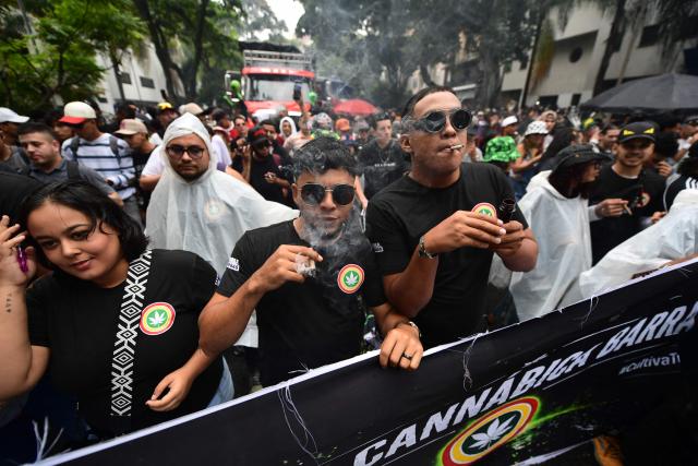 People take part in the World Marijuana March in Medellin, Colombia, on May 2, 2026. (Photo by Jaime SALDARRIAGA / AFP)