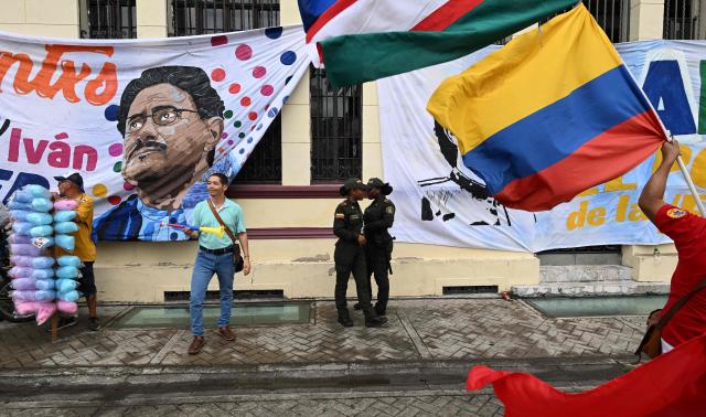 Policewomen stand guard during a campaign rally of Colombia's presidential candidate for the Pacto Historico party, Ivan Cepeda, in Cali, Colombia on May 2, 2026. (Photo by JOAQUIN SARMIENTO / AFP)