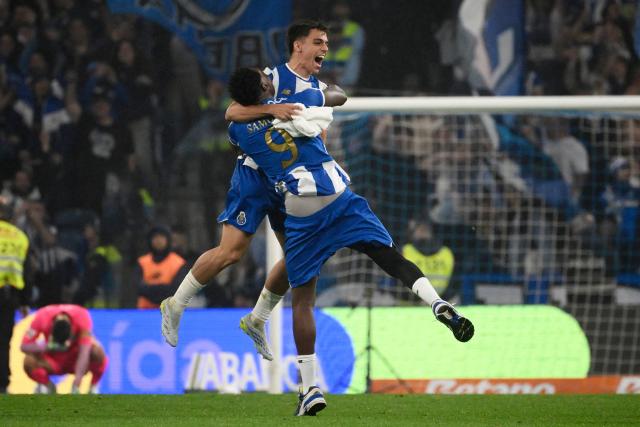 FC Porto's Spanish forward #09 Samuel Omorodion and FC Porto's Spanish midfielder #10 Gabriel Veiga celebrate their victory at the end of the Portuguese League football match between FC Porto and FC Alverca at Dragao stadium in Porto, on May 2, 2026. Porto were crowned Portuguese champions with two games to spare after a 1-0 win over Alverca today. (Photo by Miguel RIOPA / AFP)
