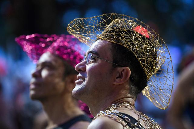 Fans watch the stage as DJ Vintage Culture performs on Copacabana Beach ahead of Colombian singer Shakira’s concert in Rio de Janeiro, Brazil, on May 2, 2026. (Photo by Daniel RAMALHO / AFP)