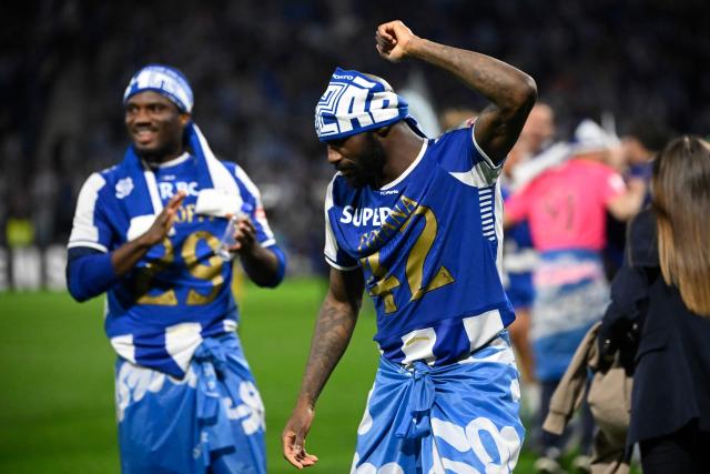 FC Porto's Nigerian forward #29 Terem Moffi and FC Porto's Ivorian midfielder #42 Seko Fofana celebrate their Portuguese League's 31st title after winning the Portuguese League football match between FC Porto and FC Alverca at Dragao stadium in Porto, on May 2, 2026. Porto were crowned Portuguese champions with two games to spare after a 1-0 win over Alverca today. (Photo by Miguel RIOPA / AFP)