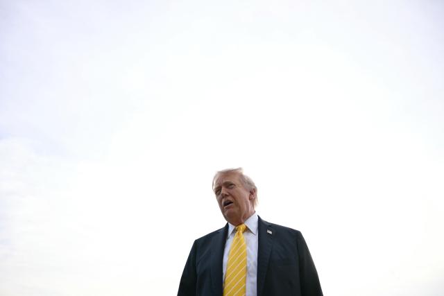 US President Donald Trump speaks with reporters at Palm Beach International Airport in West Palm Beach, Florida on May 2, 2026, before boarding Air Force One en route to Miami. (Photo by Jim WATSON / AFP)