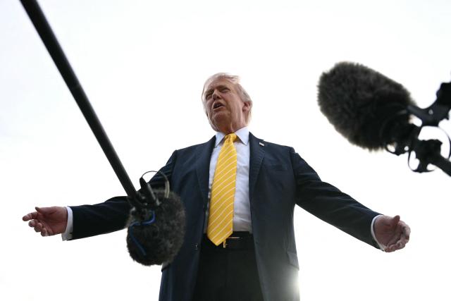 US President Donald Trump speaks with reporters at Palm Beach International Airport in West Palm Beach, Florida on May 2, 2026, before boarding Air Force One en route to Miami. (Photo by Jim WATSON / AFP)
