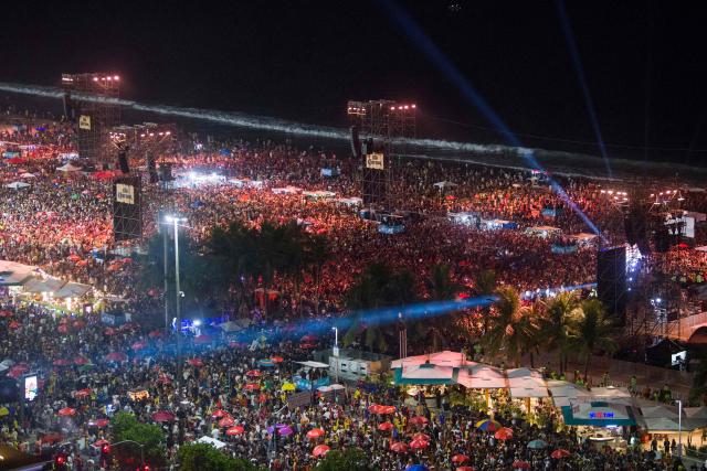 Fans gather as DJ Vintage Culture performs ahead of Colombian singer Shakira’s concert at Copacabana Beach in Rio de Janeiro, Brazil, on May 2, 2026. (Photo by Daniel RAMALHO / AFP)