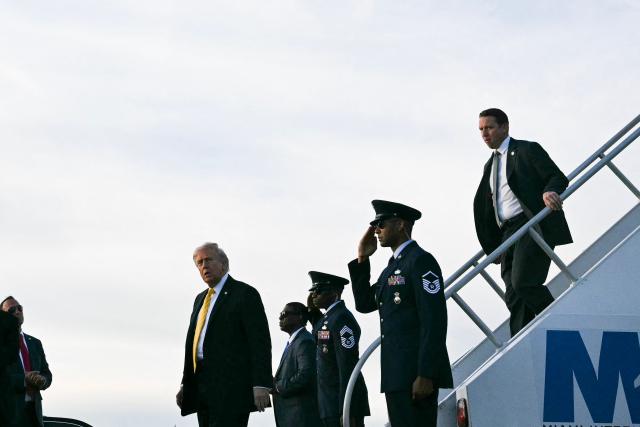 US President Donald Trump steps off Air Force One at Miami International Airport in Miami, on May 2, 2026. (Photo by Jim WATSON / AFP)