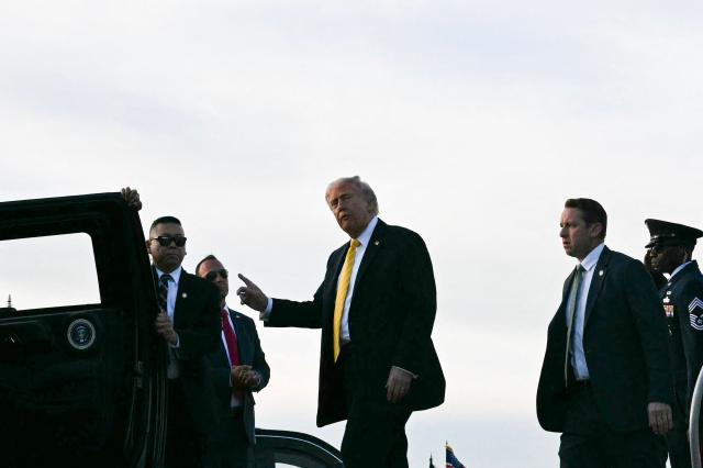 US President Donald Trump steps off Air Force One at Miami International Airport in Miami, on May 2, 2026. (Photo by Jim WATSON / AFP)