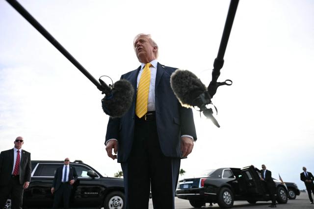 US President Donald Trump speaks with reporters at Palm Beach International Airport in West Palm Beach, Florida on May 2, 2026, before boarding Air Force One en route to Miami. (Photo by Jim WATSON / AFP)