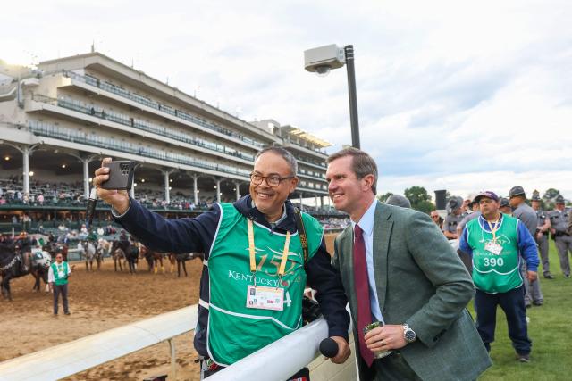 Kentucky Governor Andy Beshear takes a selfie during the 152nd running of the Kentucky Derby at Churchill Downs in Louisville, Kentucky, on May 2, 2026. (Photo by Leandro Lozada / AFP)