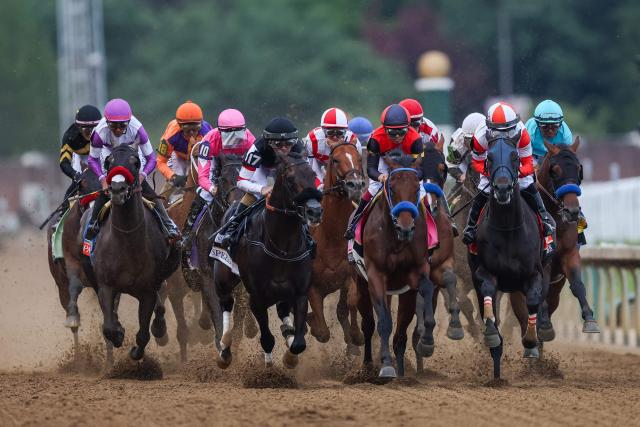 Horses race down the track during the 152nd running of the Kentucky Derby at Churchill Downs in Louisville, Kentucky, on May 2, 2026. Golden Tempo roared home to win the 152nd Kentucky Derby, making Cherie DeVaux the first woman trainer to capture the iconic race. (Photo by Leandro Lozada / AFP)
