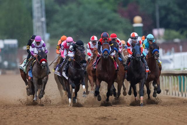 Horses race down the track during the 152nd running of the Kentucky Derby at Churchill Downs in Louisville, Kentucky, on May 2, 2026. Golden Tempo roared home to win the 152nd Kentucky Derby, making Cherie DeVaux the first woman trainer to capture the iconic race. (Photo by Leandro Lozada / AFP)