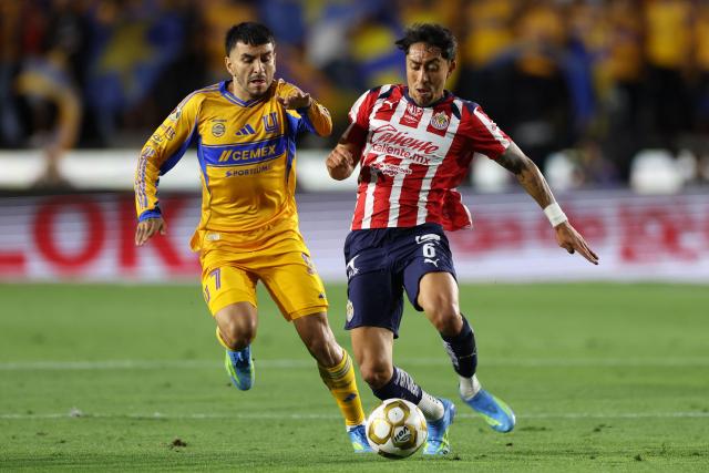 Tigres' Argentine forward #07 Angel Correa and Guadalajara's midfielder #06 Omar Govea fight for the ball during the Mexican League quarterfinal first leg football match between Tigres and Guadalajara at the Universitario stadium in Monterrey, Nuevo Leon state, Mexico on May 2, 2026. (Photo by Julio Cesar AGUILAR / AFP)
