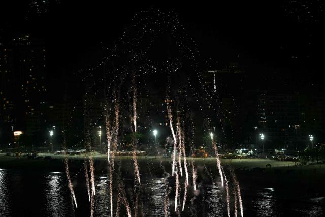 Hundreds of drones form an outlined portrait of Colombian singer Shakira before the start of a free concert at Copacabana beach in Rio de Janeiro, Brazil on May 2, 2026. (Photo by Mauro PIMENTEL / AFP)