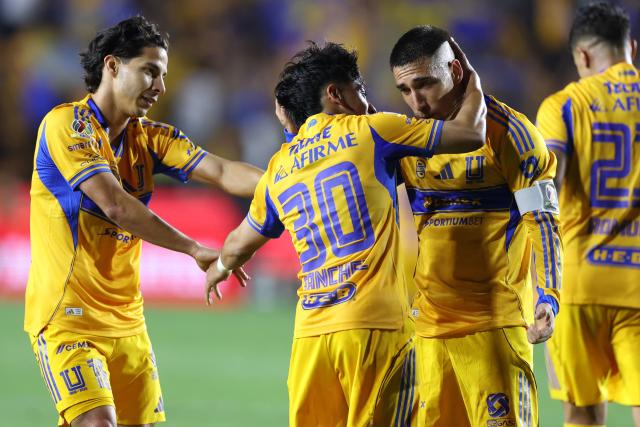 Tigres' forward #30 Diego Sanchez celebrates with Uruguayan midfielder #08 Fernando Gorriaran (R) and midfielder #16 Diego Lainez after scoring his team's third goal during the Mexican League Clausura Tournament quarterfinal first leg football match between Tigres and Guadalajara at the Universitario stadium in Monterrey, Nuevo Leon state, Mexico on May 2, 2026. (Photo by Julio Cesar AGUILAR / AFP)