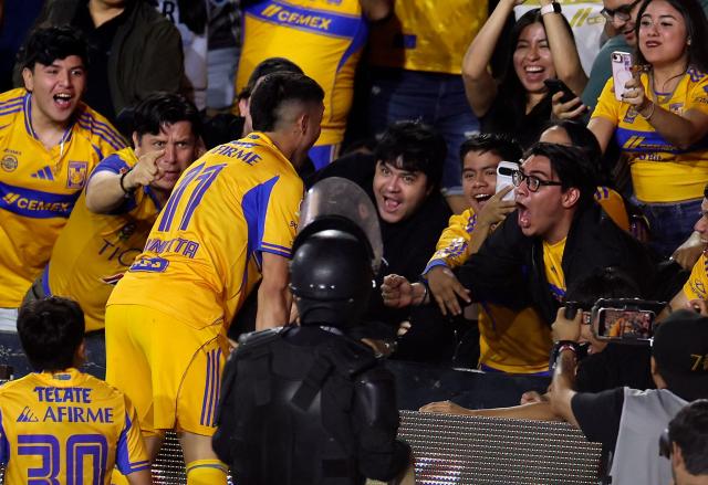 Tigres' Argentine midfielder #11 Juan Brunetta celebrates with fans after scoring his team's second goal during the Mexican League Clausura Tournament quarterfinal first leg football match between Tigres and Guadalajara at the Universitario stadium in Monterrey, Nuevo Leon state, Mexico on May 2, 2026. (Photo by Julio Cesar AGUILAR / AFP)