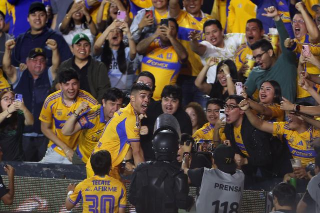Tigres' Argentine midfielder #11 Juan Brunetta celebrates with fans after scoring his team's second goal during the Mexican League Clausura Tournament quarterfinal first leg football match between Tigres and Guadalajara at the Universitario stadium in Monterrey, Nuevo Leon state, Mexico on May 2, 2026. (Photo by Julio Cesar AGUILAR / AFP)