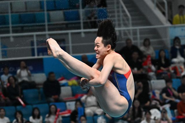 Chinaґs Chen Yiwen competes in the women’s 3m springboard event during the World Aquatics Diving World Cup Super Final at the Water Cube in Beijing on May 3, 2026. (Photo by Pedro PARDO / AFP)