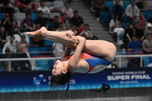 Chinaґs Chen Jia competes in the women’s 3m springboard event during the World Aquatics Diving World Cup Super Final at the Water Cube in Beijing on May 3, 2026. (Photo by Pedro PARDO / AFP)