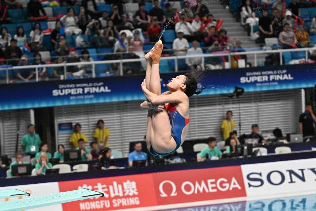 Chinaґs Chen Jia competes in the women’s 3m springboard event during the World Aquatics Diving World Cup Super Final at the Water Cube in Beijing on May 3, 2026. (Photo by Pedro PARDO / AFP)