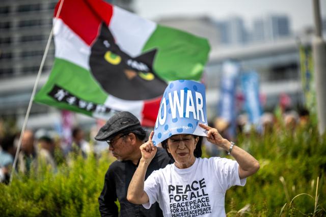 People take part in the Grand Constitution Rally 2026 to mark Constitution Memorial Day in Tokyo on May 3, 2026. (Photo by Philip FONG / AFP)