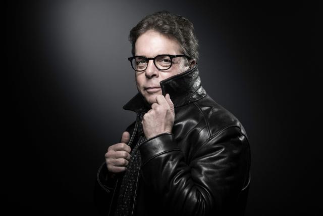 (FILES) US novelist Douglas Kennedy  poses during a photo session in Paris on November 2, 2017. Dubbed "the most European of American novelists," Douglas Kennedy is back in bookstores with "The Man Who Didnt Have Enough of One Life" (Belfond), set for release on May 5, 2026. His 27th book is a sequel to one of his best-sellers, "The Man Who Wanted to Live His Life", published 28 years ago, which tells the story of an American who erases his identity in order to start over from scratch. Translated into 16 languages, the novel was particularly well received in France, where Kennedy has since sold more than eight million copies, according to his publisher. (Photo by JOEL SAGET / AFP)