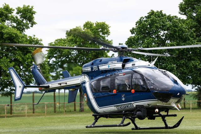France's Interior Minister Laurent Nunez looks on as he boards a Gendarmerie Eurocopter EC145 helicopter to fly over the site of a "teknival" rave party at a military site in Cornusse, near Bourges, central France on May 3, 2026. Between 17,000 and 40,000 people participate in the free party which has been taking place, without major incident, since May 1, 2026. The gathering comes as the French parliament is seeking to tighten legislation against unauthorised rave parties, introducing prison sentences for organisers and fines for attendees. (Photo by Kenzo TRIBOUILLARD / AFP)