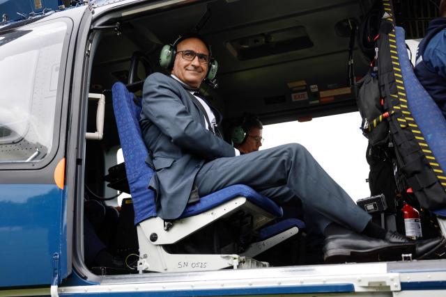 France's Interior Minister Laurent Nunez looks on as he boards a Gendarmerie Eurocopter EC145 helicopter to fly over the site of a "teknival" rave party at a military site in Cornusse, near Bourges, central France on May 3, 2026. Between 17,000 and 40,000 people participate in the free party which has been taking place, without major incident, since May 1, 2026. The gathering comes as the French parliament is seeking to tighten legislation against unauthorised rave parties, introducing prison sentences for organisers and fines for attendees. (Photo by Kenzo TRIBOUILLARD / AFP)