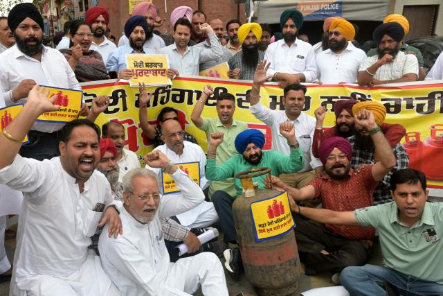 Aam Aadmi Party (AAP) workers shout anti-government slogans during a protest against the hike in price of commercial liquefied petroleum gas (LPG) cylinders amid global energy crisis owing to the Middle East war, in Amritsar on May 3, 2026. (Photo by Narinder NANU / AFP)