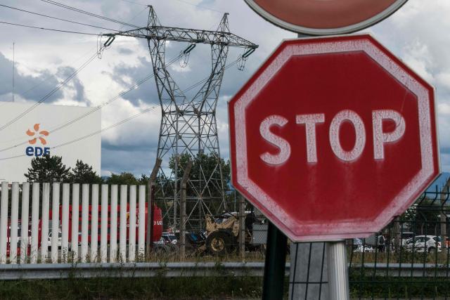 (FILES) This picture taken on June 29, 2020 shows a stop roadsign in front of the nuclear powerplant in Fessenheim, eastern France. The government has authorised, in a decree published on May 3, 2026 in the Official Journal, the complete dismantling by EDF of the former Fessenheim nuclear power plant in eastern France, including its most sensitive components such as the reactors, setting out the procedures and timetable. (Photo by SEBASTIEN BOZON / AFP)