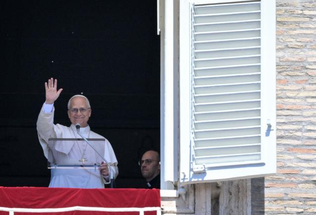Pope Leo XIV addresses the crowd from a window of the Apostolic Palace overlooking St. Peter's Square during the Regina Caeli prayer in the Vatican on May 3, 2026. (Photo by TIZIANA FABI / AFP)