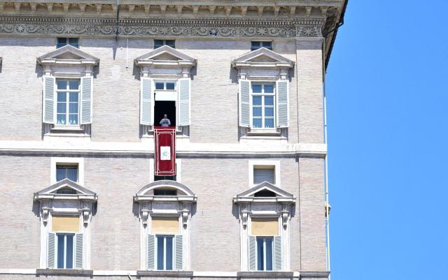 Pope Leo XIV addresses the crowd from a window of the Apostolic Palace overlooking St. Peter's Square during the Regina Coeli prayer in the Vatican on May 3, 2026. (Photo by TIZIANA FABI / AFP)