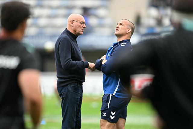 Montpellier's French head coach Joan Caudullo (R) speaks with Montpellier's French sporting director Bernard Laporte prior to the European Challenge Cup rugby union semi-final match between Montpellier Herault Rugby and Dragons RFC at the Septeo Stadium in Montpellier, southern France, on May 3, 2026. (Photo by Gabriel BOUYS / AFP)
