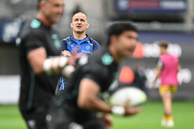 Montpellier's French head coach Joan Caudullo looks on during warm up prior to the  European Challenge Cup rugby union semi-final match between Montpellier Herault Rugby and Dragons RFC at the Septeo Stadium in Montpellier, southern France, on May 3, 2026. (Photo by Gabriel BOUYS / AFP)