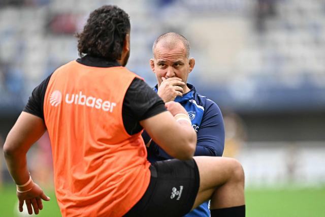 Montpellier's French head coach Joan Caudullo speaks with a player prior to the European Challenge Cup rugby union semi-final match between Montpellier Herault Rugby and Dragons RFC at the Septeo Stadium in Montpellier, southern France, on May 3, 2026. (Photo by Gabriel BOUYS / AFP)
