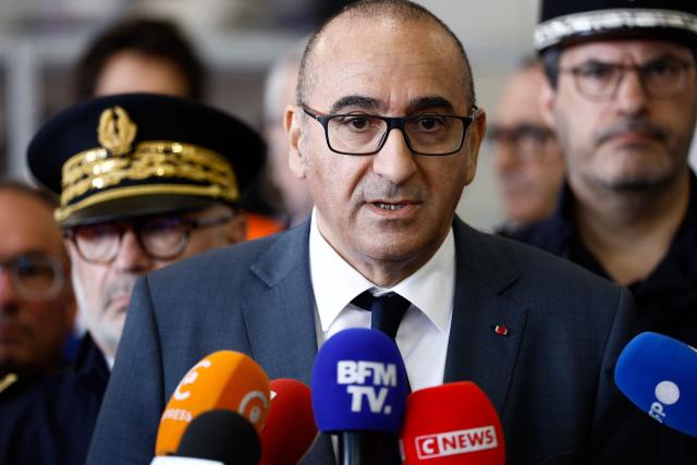 France's Interior Minister Laurent Nunez speaks to the press during a presentation of the fire brigade's deployment on and around a "teknival" rave party at a military site in Cornusse, near Bourges, at a fire station in Baugy, central France on May 3, 2026. Between 17,000 and 40,000 people participate in the free party which has been taking place, without major incident, since May 1, 2026. The gathering comes as the French parliament is seeking to tighten legislation against unauthorised rave parties, introducing prison sentences for organisers and fines for attendees. (Photo by Kenzo TRIBOUILLARD / AFP)