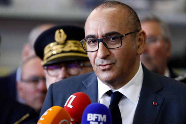 France's Interior Minister Laurent Nunez speaks to the press during a presentation of the fire brigade's deployment on and around a "teknival" rave party at a military site in Cornusse, near Bourges, at a fire station in Baugy, central France on May 3, 2026. Between 17,000 and 40,000 people participate in the free party which has been taking place, without major incident, since May 1, 2026. The gathering comes as the French parliament is seeking to tighten legislation against unauthorised rave parties, introducing prison sentences for organisers and fines for attendees. (Photo by Kenzo TRIBOUILLARD / AFP)