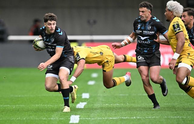 Montpellier’s French wing Melvyn Rates (L) is tackled during the European Challenge Cup rugby union semi-final match between Montpellier Herault Rugby and Dragons RFC at the Septeo Stadium in Montpellier, southern France, on May 3, 2026. (Photo by Gabriel BOUYS / AFP)