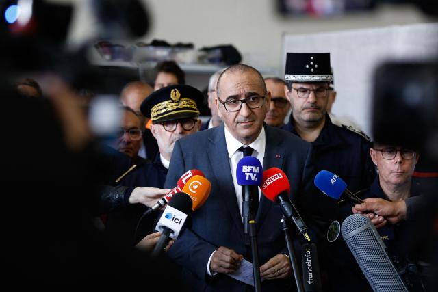 France's Interior Minister Laurent Nunez speaks to the press during a presentation of the fire brigade's deployment on and around a "teknival" rave party at a military site in Cornusse, near Bourges, at a fire station in Baugy, central France on May 3, 2026. Between 17,000 and 40,000 people participate in the free party which has been taking place, without major incident, since May 1, 2026. The gathering comes as the French parliament is seeking to tighten legislation against unauthorised rave parties, introducing prison sentences for organisers and fines for attendees. (Photo by Kenzo TRIBOUILLARD / AFP)