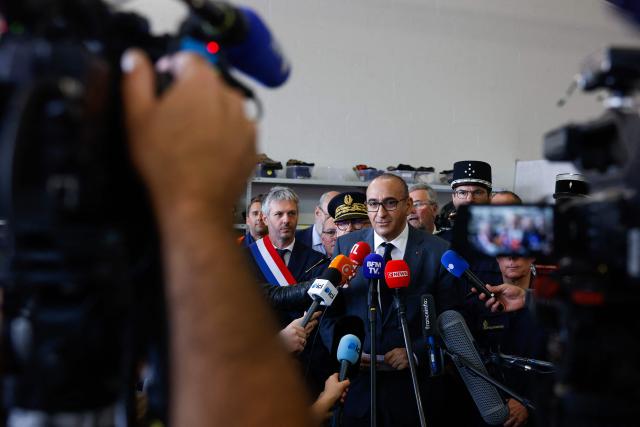 France's Interior Minister Laurent Nunez speaks to the press during a presentation of the fire brigade's deployment on and around a "teknival" rave party at a military site in Cornusse, near Bourges, at a fire station in Baugy, central France on May 3, 2026. Between 17,000 and 40,000 people participate in the free party which has been taking place, without major incident, since May 1, 2026. The gathering comes as the French parliament is seeking to tighten legislation against unauthorised rave parties, introducing prison sentences for organisers and fines for attendees. (Photo by Kenzo TRIBOUILLARD / AFP)