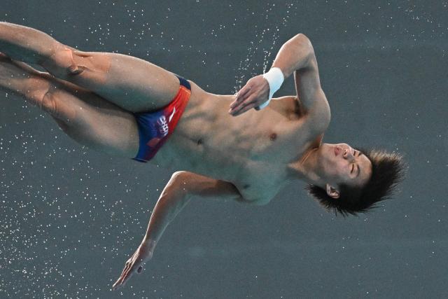 China’s Bai Yuming competes in the men’s 10m platform event at the World Aquatics Diving World Cup Super Finals in Beijing on May 3, 2026. (Photo by Pedro PARDO / AFP)